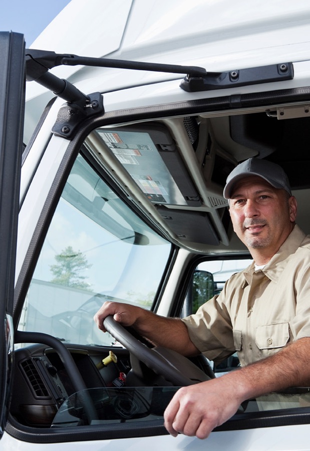 Owner operator in the cab of his truck